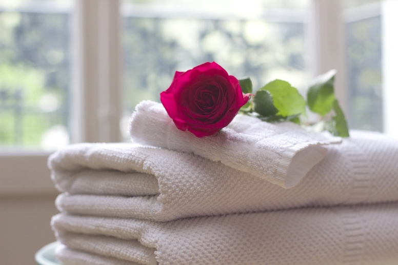 Spa towels and a rose